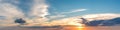 Vibrant color panoramic sun rise and sun set sky with cloud on a cloudy day. Royalty Free Stock Photo