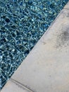 Vibrant color pool with a concrete edge Royalty Free Stock Photo