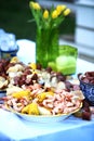 Vibrant color with yellow flowers and a delicious low country shrimp boil. Royalty Free Stock Photo