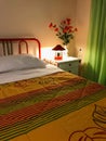 Vibrant Colored Interior of a bedroom. Pillow and colorful coverlet on the bed. Bedroom interior design