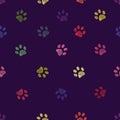 Vibrant colorful doodle paw prints. Seamless for textile design with purple background pattern