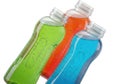 Vibrant colorful energy drinks in clear bottles with refreshing bubbles Royalty Free Stock Photo