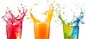 Refreshing fruit juice splashing out of glasses isolated on white background Royalty Free Stock Photo