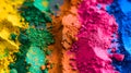 Vibrant colorful piles of yellow, pink, green, blue and orange pigment powders gather in vertical lines. Suitable for Holi