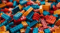 Vibrant and colorful plastic blocks being played by a little boy in a close up shot.