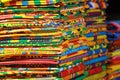 Stacks of African kente cloth on the streets of Accra