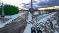 Vibrant colors in winter landscape with railroad crossing and country road Royalty Free Stock Photo