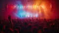 A vibrant concert crowd basking in the glow of colorful stage lights. Confetti in the air, adding to the atmosphere of celebration Royalty Free Stock Photo