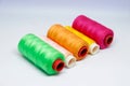 A vibrant, 45-degree shot of five spools of thread. Royalty Free Stock Photo