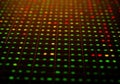 Vibrant digital data grid with glowing green, yellow, and red nodes Royalty Free Stock Photo