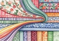 Verlapping fabric patterns, featuring various designs such as floral, Royalty Free Stock Photo