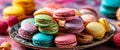 Colorful assorted macarons on decorative plate