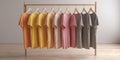 The vibrant display of assorted t-shirts hanging on a wooden rack AI generated image Royalty Free Stock Photo