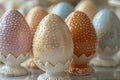 Elegant Decorated Easter Eggs in Pastel Tones Displayed on Stands Royalty Free Stock Photo