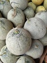 Piles of green melons stacked in such a way Royalty Free Stock Photo