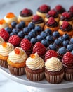 Vibrant Display Of Mini Cupcakes With Berries. Royalty Free Stock Photo