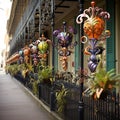 A row of colorful decorative objects on a fence