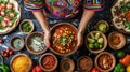 Mexican Fiesta: Hands Presenting Hearty Chili with Garnishes and Traditional Accompaniments Royalty Free Stock Photo