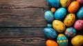 Vibrant easter eggs arranged on a rustic wooden table for spring celebrations Royalty Free Stock Photo
