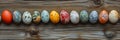 Colorful Easter eggs beautifully arranged on a rustic wooden surface for spring festivities Royalty Free Stock Photo