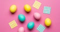 Vibrant Easter Eggs Scattered on Pink Background with Gingham Accents Royalty Free Stock Photo