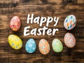 Vibrant eggs and calligraphy combine on a rustic wooden surface for Easter Royalty Free Stock Photo