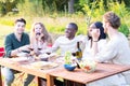 Vibrant Evening Garden Party with Multi-Ethnic Millennial Friends Having Conversations and Fun