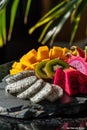 Vibrant exotic fruit platter with dragon fruit and kiwi, AI Generated.