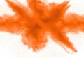 Explosion of orange powder isolated on white background Royalty Free Stock Photo