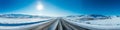 Vibrant extra wide panoramic sky. Winter highway. Snow covered street leading to the horizon