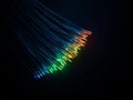 Vibrant fiber optic cables glowing with multicolored light strands against a dark background for high speed data tech Royalty Free Stock Photo