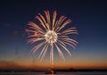 A vibrant firework explodes over a Royalty Free Stock Photo