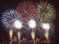 Vibrant fireworks displays illuminate the night sky Royalty Free Stock Photo
