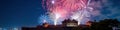Vibrant fireworks illuminate night sky over historic castle Royalty Free Stock Photo