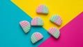 Vibrant Pink and Green Candies on Colorful Geometric Background Royalty Free Stock Photo