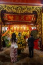 Vibrant floral decorations of Ngoc Son Temple during the Lunar New Year celebration. Vietnam.