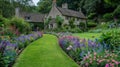 Vibrant Flowerbeds and Curving Grass Path in a Charming English Formal Garden Royalty Free Stock Photo