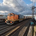 Vibrant freight trains on railway station, goods transported on colorful wagons