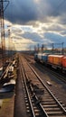 Vibrant freight trains on railway station, goods transported on colorful wagons