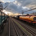 Vibrant freight trains on railway station, goods transported on colorful wagons