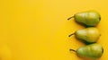 Vibrant Fresh Green Pears on Bright Yellow Background