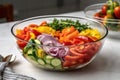 A vibrant, fresh vegetable medley, with colorful peppers, tomatoes, zucchini, and onions, artfully displayed in a glass bowl on a