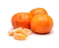 Vibrant fruit. Studio shot of tangerine slices beside whole fruits.