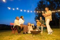 Vibrant Garden Party: Friends Unite with Music and Laughter, a multi ethnic group of friends on a garden party in the