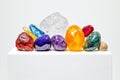 Vibrant Gemstone Collection A stunning array of colorful gemstones including amethyst ruby and quartz displayed on a white