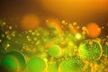 Vibrant Glitter: Defocused Orange and Green Background