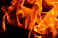 The material burns with a bright saturated flame as a background. Royalty Free Stock Photo