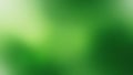 A vibrant green abstract background with a gradient effect that subtly transitions from light to dark in a soft and textured Royalty Free Stock Photo