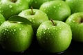 Vibrant green apple with morning dew drops, a fresh, tempting treat Royalty Free Stock Photo