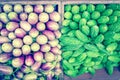 Vibrant green bitter melon and purple Asian eggplants at vegetable stand in Little India, Singapore Royalty Free Stock Photo